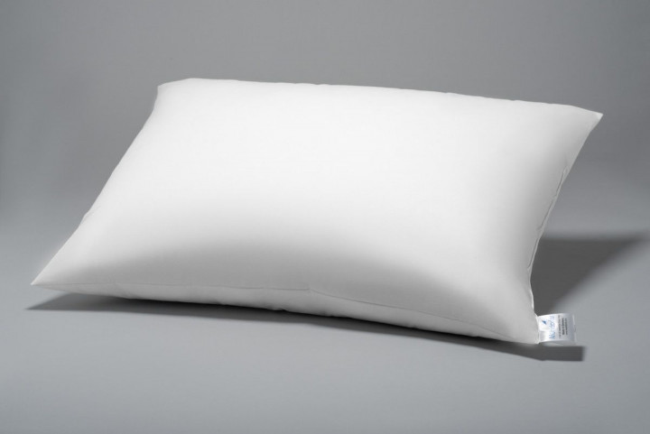 a white pillow on a gray background